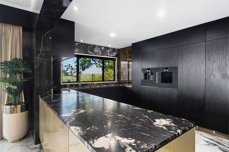 living room with black and white rug marble walls  24 Half Moon Rise, Half Moon Bay, Auckland