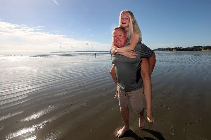 Ray White agent Dylan Turner with his wife Sharon and daughter Zoe in their home turf of Orewa. Photo / Fiona Goodall