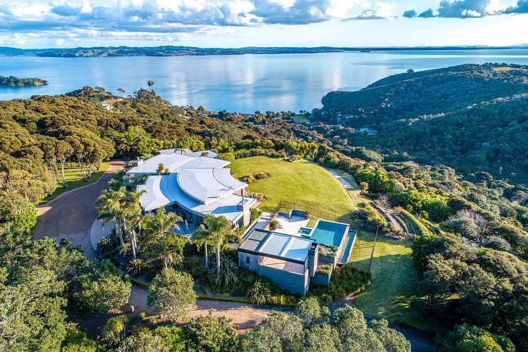 white and timber house with multiple rooves and sea view 66 Kennedy Point Road, Kennedy Point, Waiheke Island