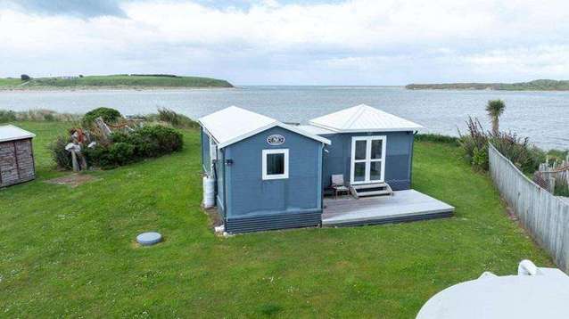 Tiny South Island bach with $100,000 RV smashes it at auction