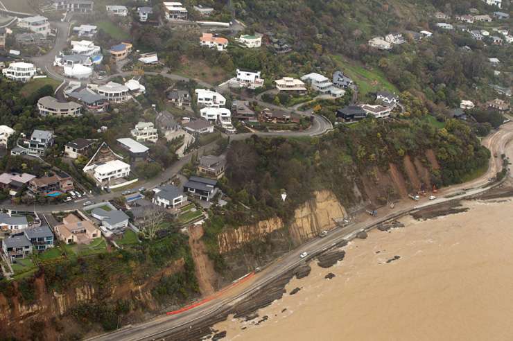 Residential buildings in the Owhiro Bay area in Wellington. More New Zealand homeowners can expect to to feel the impact of climate change as the planet suffers more extreme weather events. Photo / Getty Images