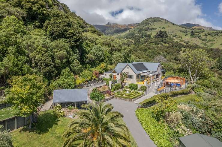 The three-bedroom home at 10 Purple Peak Road, in Akaroa, Banks Peninsula, goes to auction on March 30. The house comes with a 2005 Bentley Continental GT V12. Photo / Supplied