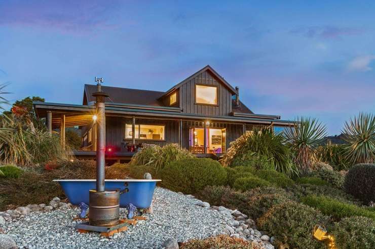 The luxury retreat at 44 Ruru Lane, in Mokihinui, Buller, is on the market for <img.48m-plus. Photo / Supplied