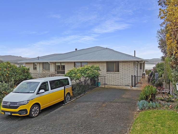 A three-bedroom, two-bathroom bach on Vista Paku, in Pauanui, received multiple offers after a busy open at the weekend. Photo / Supplied