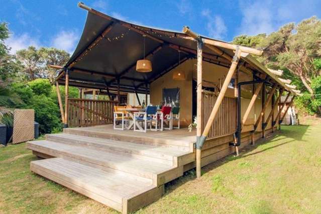 'Absolutely waterfront': Rare Great Barrier glamping retreat up for grabs for less than $1m