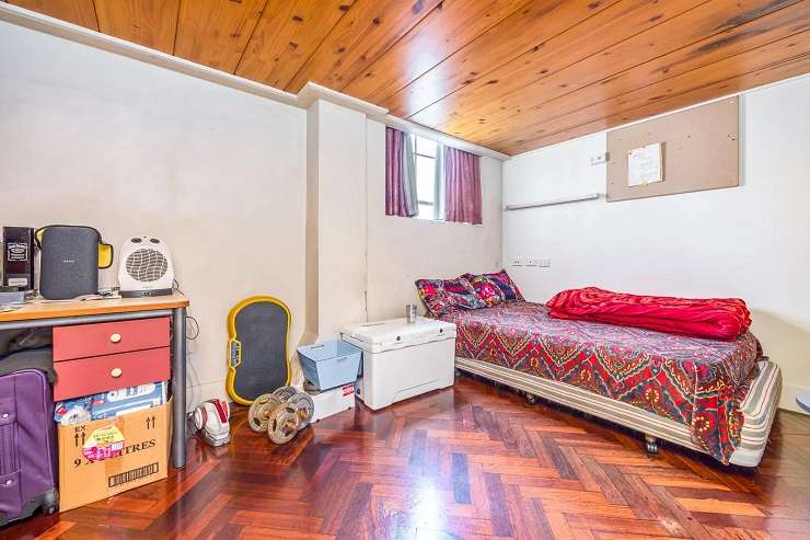 A three-bedroom, one-bathroom apartment in Grand Central, in Central Auckland, is to be sold at a <img reserve auction on Thursday. Photo / Supplied