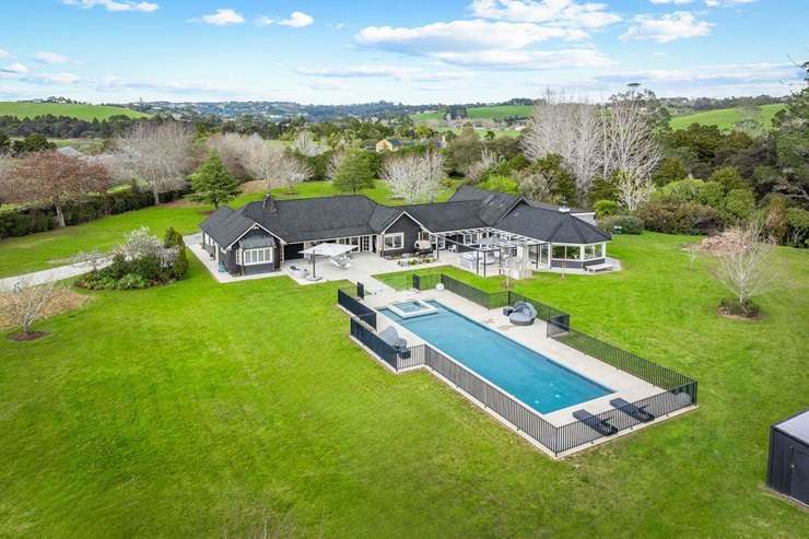 Designed by Leuschke Architects, this new-build on Coatesville-Riverhead Highway, in Auckland's Coatesville, was snapped up in June. Photo / Supplied