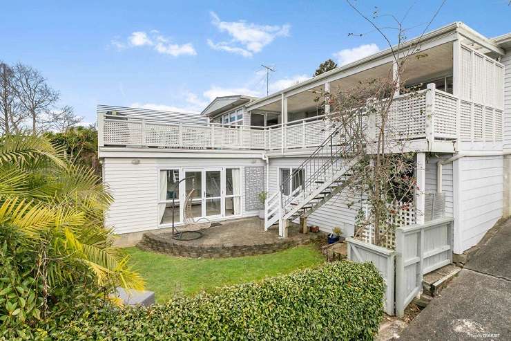 beige 1950s house with tile roof and green lawn  105 Parau Street, Mount Eden, Auckland