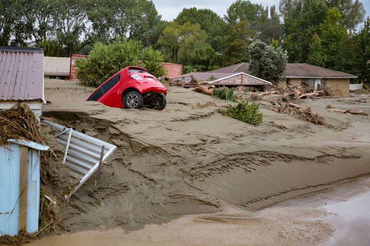 The impact of Cyclone Gabrielle on Muriwai, Auckland. Landslides in the beach suburb claimed the lives of two firefighters. Photo / George Heard