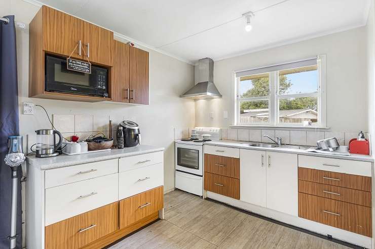 A three-bedroom brick and tile house at 5 Corsair Crescent, in south Auckland, goes to auction on May 1. Photo / Supplied