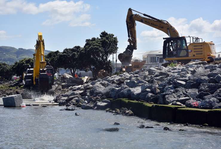 Residential buildings in the Owhiro Bay area in Wellington. More New Zealand homeowners can expect to to feel the impact of climate change as the planet suffers more extreme weather events. Photo / Getty Images