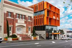 Auckland's iconic orange mixed-use building for sale