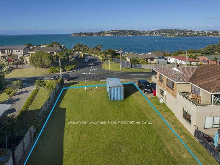 A modest 1970s four-bedroom house on a 7894sqm site on Matija Place, Red Beach, Auckland, sold for $4.15m at auction this week. Photo / Supplied