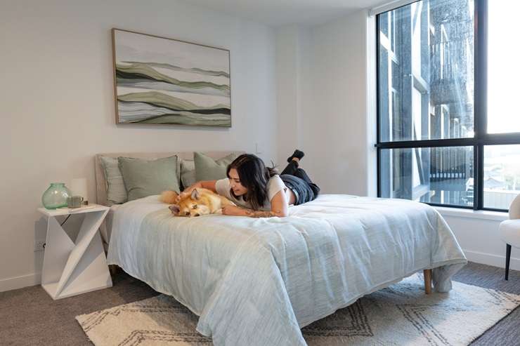 The new Resido apartment complex - three blocks of 295-unit apartments next to Auckland's Sylvia Park - is promoting itself as a pet-friendly development. Right, is one of the new residents, Lily. Photo / Jason Oxenham, Supplied