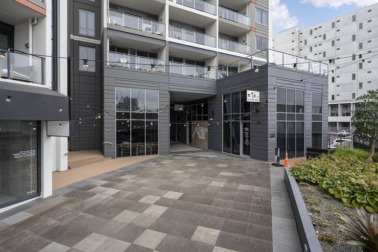 grey shops with apartments above and courtyard  units 2 and 4, 27 SugarTree apartments, 27 Union Street, Auckland City