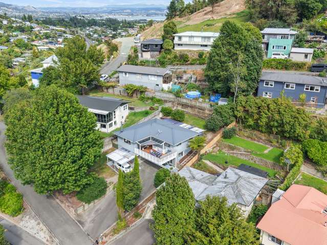 An Elevated Family Retreat with Income Potential!