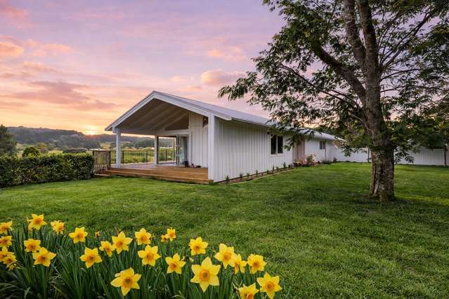 METICULOUSLY RENOVATED ON ONE ACRE OF LAND