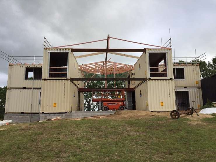 The five-bedroom, three-bathroom home on Ranby Road, in Ohaupo, was built using 12 steel shipping containers. Photo / Supplied
