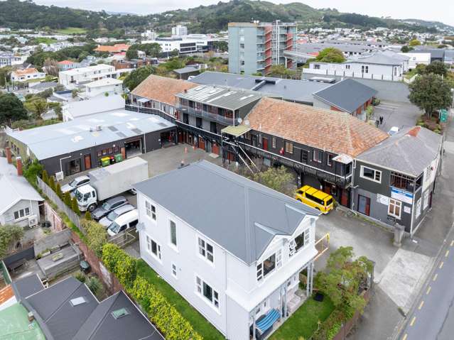 Prime development site with holding income