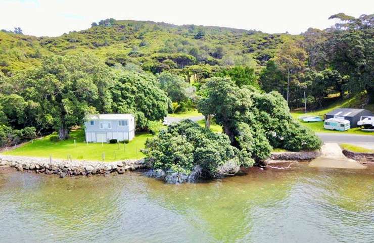 The four-bedroom house on Whangaparapara Road, Great Barrier Island, was on the market at <img.4m. Photo / Supplied