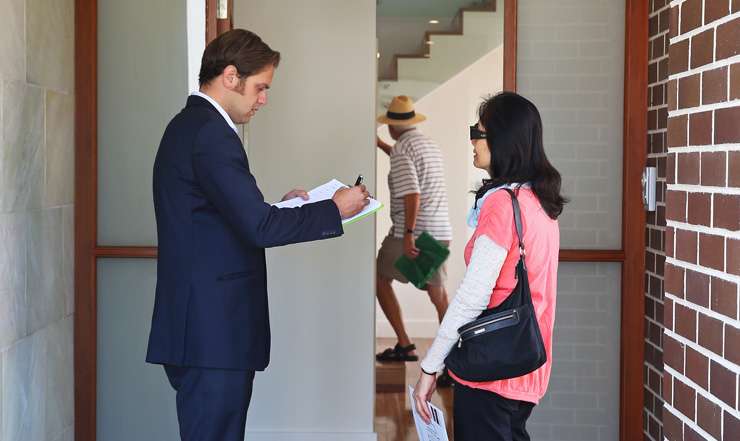 Serious buyers should carry a checklist and take notes at open homes. Photo / Getty Images