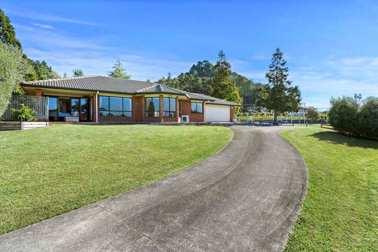 An absolute beachfront home at 22 McCall Avenue, in Pauanui, is one of dozens of Coromandel homes to hit the market recently. Photo / Supplied