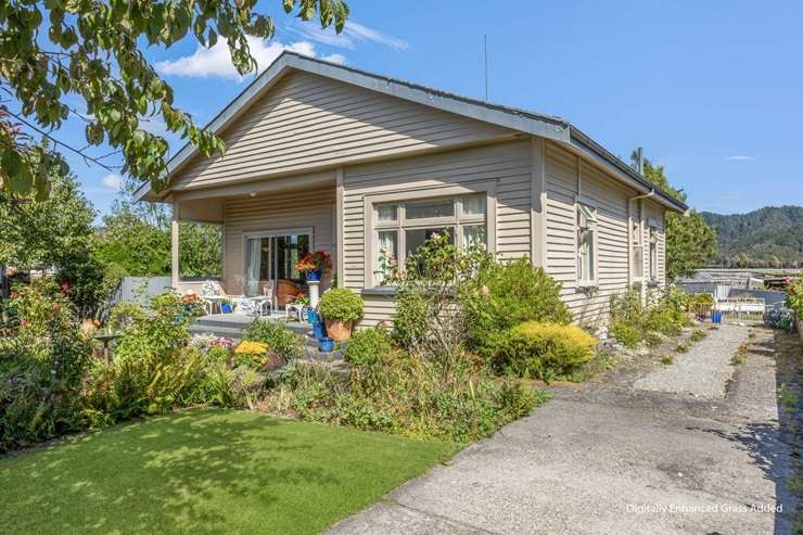 A three-bedroom, one-bathroom deceased estate on South Street, in Runanga that has a price tag of $235,000 is catching the eye of investors. Photo / Supplied