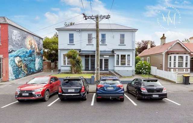 Uni’s ‘party street’ flats snapped up for just under $2m