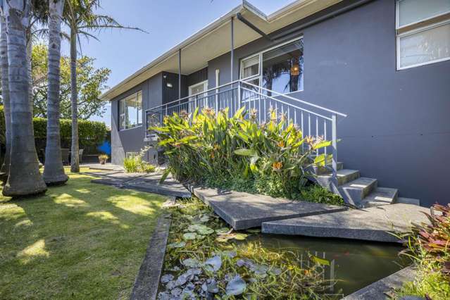 ELEVATED LARGE TWO LEVEL FAMILY HOME