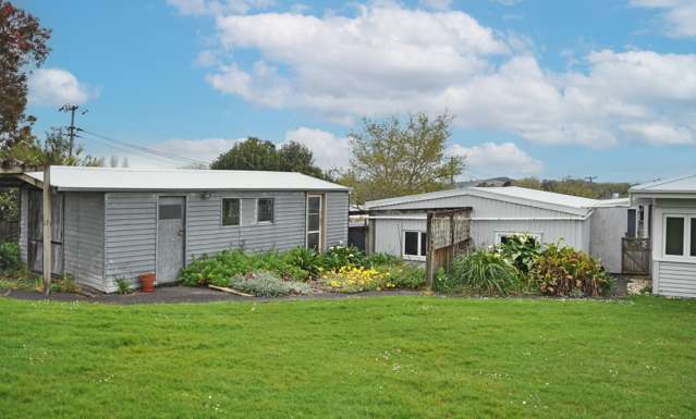 4 BEDROOMS, OFFICE AND LOTS OF SHEDS!