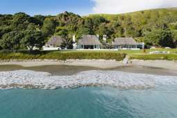 Luxury beachfront enclave with four homes, landscaped gardens and a Pacific vibe for sale
