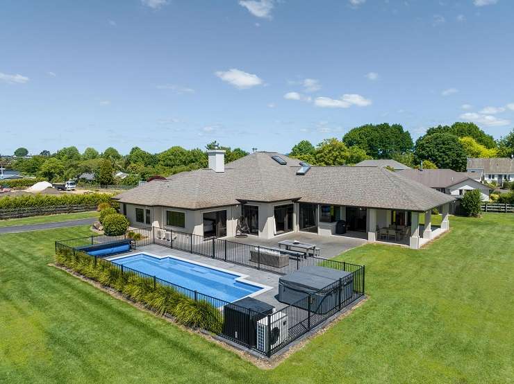 Waterfront homes such as this large property on Waratah Street, in Matua, sold within a week of hitting the market. Photo / Supplied