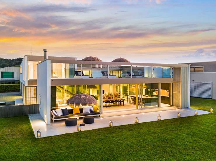 A four-bedroom bach at 6 Taiawa Place, Omaha, is up for grabs. Buyers also have the chance to acquire the 1117sqm vacant section in front. Photo / Supplied