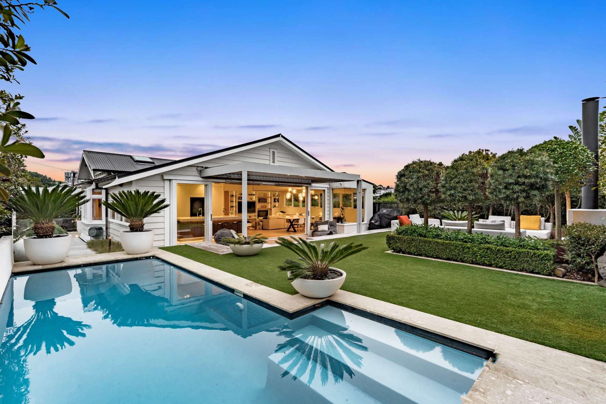 ‘It’s such a social house’: Auckland home with a backyard oasis on the market