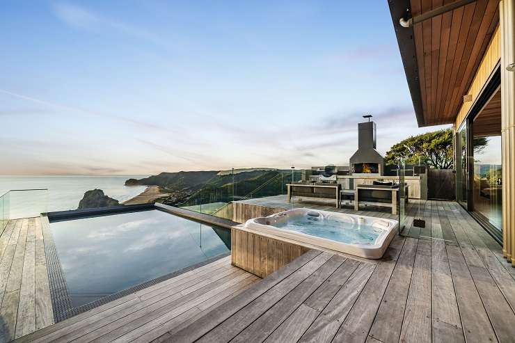 cedar and steel modern house with swimming pool and steps in front  81 Piha Road, Piha, west Auckland