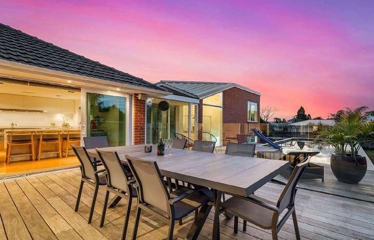 brick house with sunset sky and reflecting pool in front 444 Old Te Atatu Road, Te Atatu, Auckland