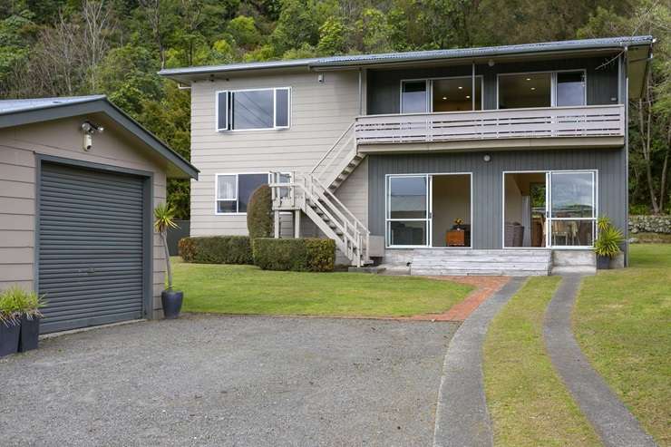 The 1950s basic three-bedroom bach for sale at 1 Parekarangaranga Street, in Motuoapa. Photo / Supplied