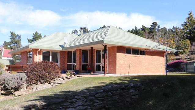 Enjoy breathtaking views from this beautiful, sunny three-bedroom home