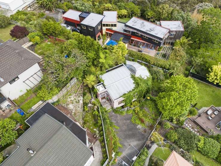 The colourful 133 West Harbour Drive, left, and the rundown 1/125 West Harbour Drive, both in Auckland's West Harbour, are up for grabs. Photo / Supplied