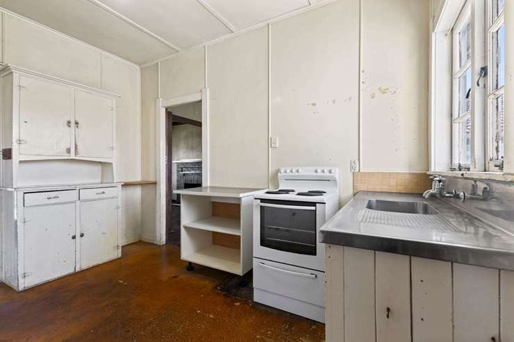 A shabby weatherboard home on Carruth Road, in Papatoetoe, sold for an unexpected <img.72m at auction earlier this month. Photo / Supplied