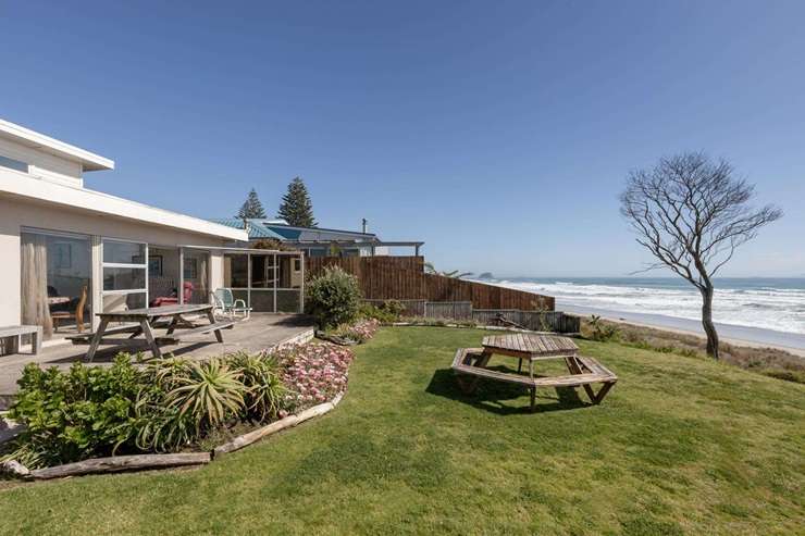 Listing agent Kay Ganley's mum Judy and her granddaughter Georgia appear in the marketing video for the 1950s beachfront bach on Oceanbeach Road, in Mount Maunganui. Photo / Supplied