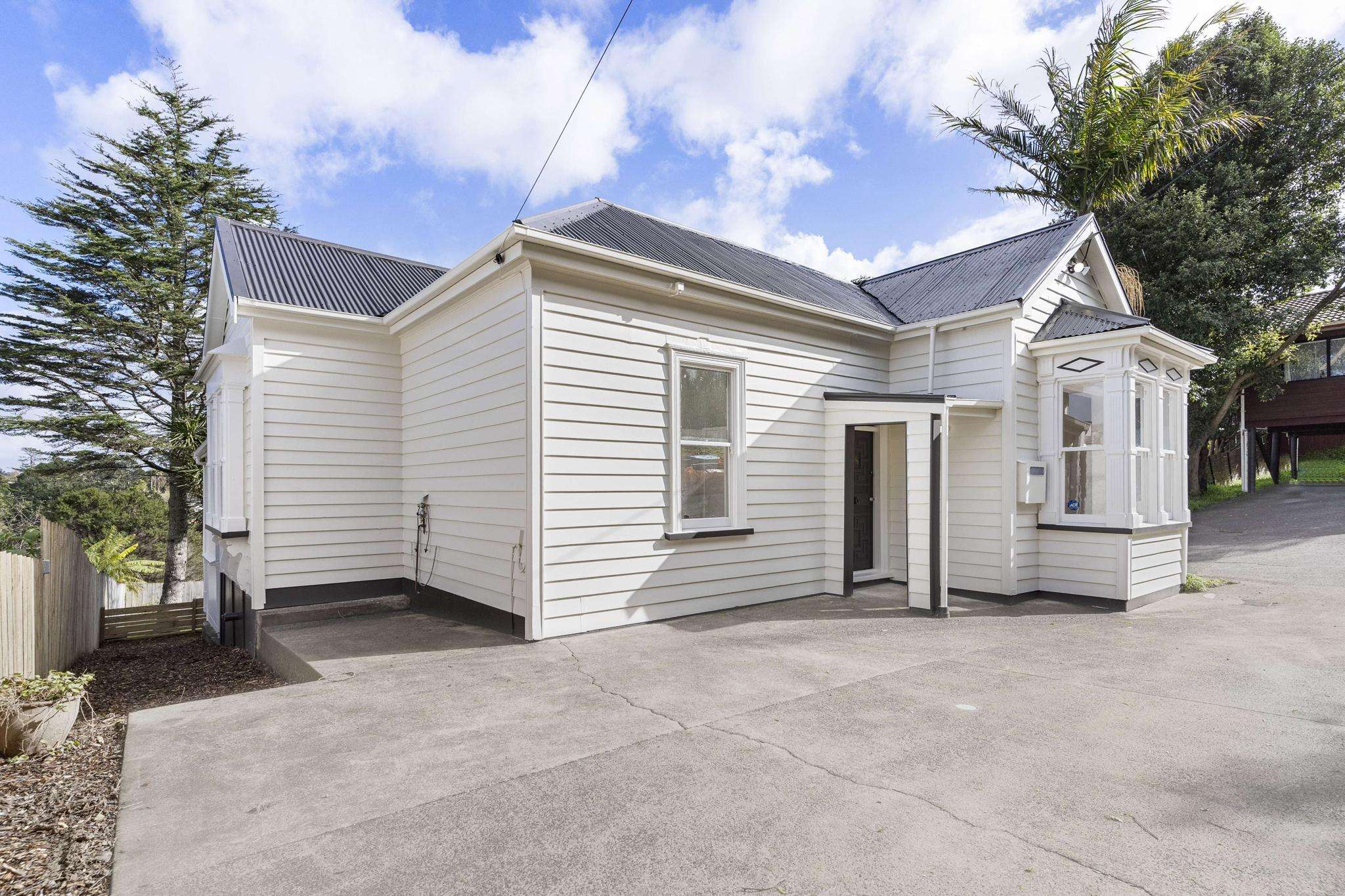 Crazy backstory of swish Auckland villa that’ll sell for less than $1m