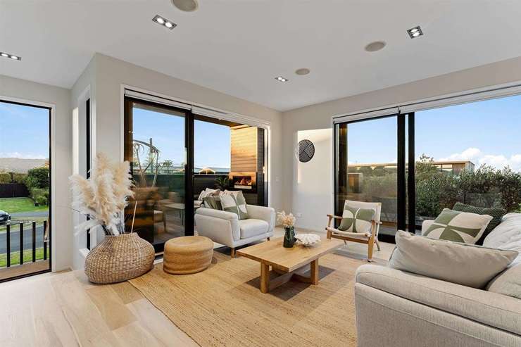 A four-bedroom bach at 6 Taiawa Place, Omaha, is up for grabs. Buyers also have the chance to acquire the 1117sqm vacant section in front. Photo / Supplied