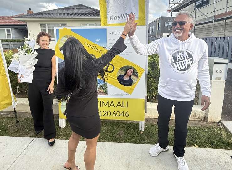 Mike King hugs his listing agent Fatima Ali after his Papatoetoe property sold. Photo / Supplied