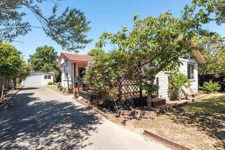 A 1950s classic brick house on Wai-iti Terrace, in Fendalton, saw more people through its first weekend of open homes than most houses see during an entire auction campaign. Photo / Supplied