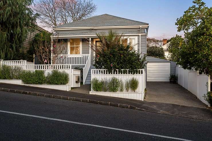 beige 1950s house with tile roof and green lawn  105 Parau Street, Mount Eden, Auckland