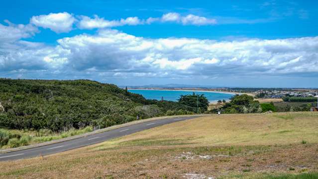 Elevated and sunny with beach and bay views!