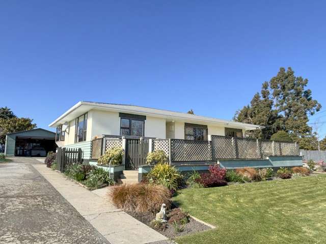 Warm home with garaging on large section