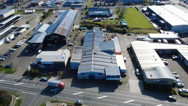 Industrial warehouse with crane and frontage