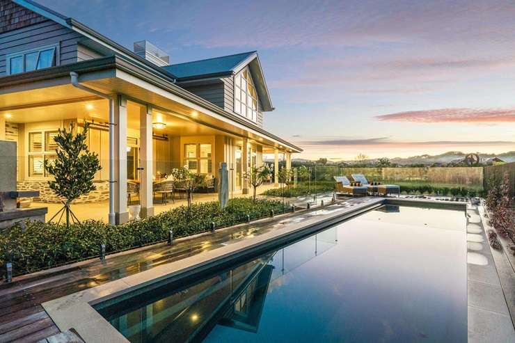 A four-bedroom bach at 6 Taiawa Place, Omaha, is up for grabs. Buyers also have the chance to acquire the 1117sqm vacant section in front. Photo / Supplied